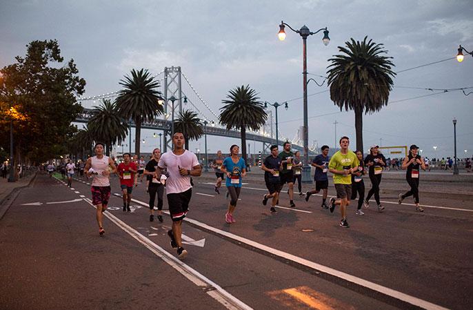 Photo: Runners going down the road feeling GOOD in San Francisco during the 2017 JPM Corporate Challenge.