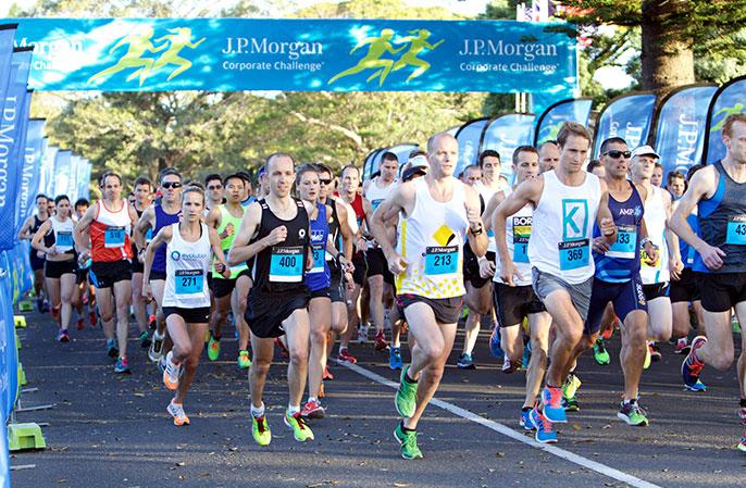 Laura James (bib number 271) heads off from the Centennial Park starting line at the 2014 J.P. Morgan Corporate Challenge, a race that spoke to her perseverance.